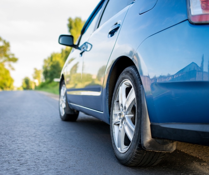 Blue car on road